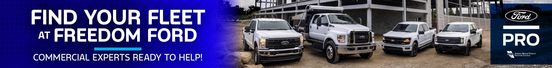 Lineup of Ford commercial trucks and work vehicles parked in front of a steel-frame construction site, with the text “Find Your Fleet at Freedom Ford – Commercial Experts Ready to Help!”